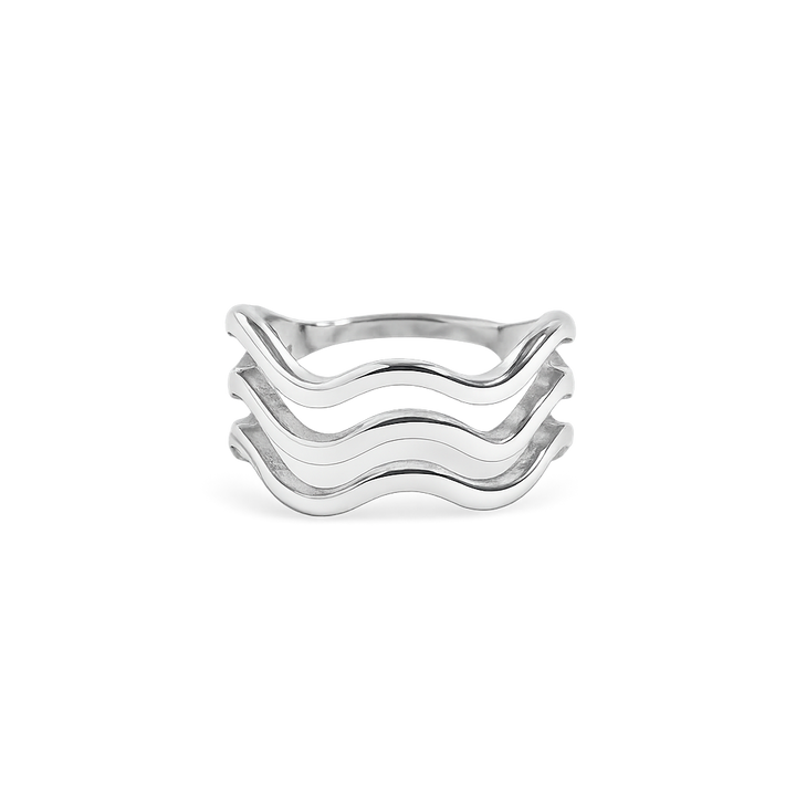 Silver ring with wavy design on a white background