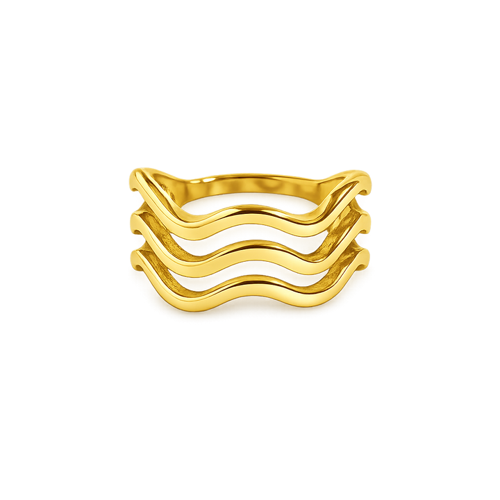 Gold ring with wavy design on a white background