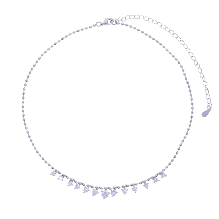 A delicate silver-toned beaded necklace with a row of small clear rhinestone charms spelling 'LOVE' and a teardrop-shaped clear rhinestone pendant, displayed on a solid white background.